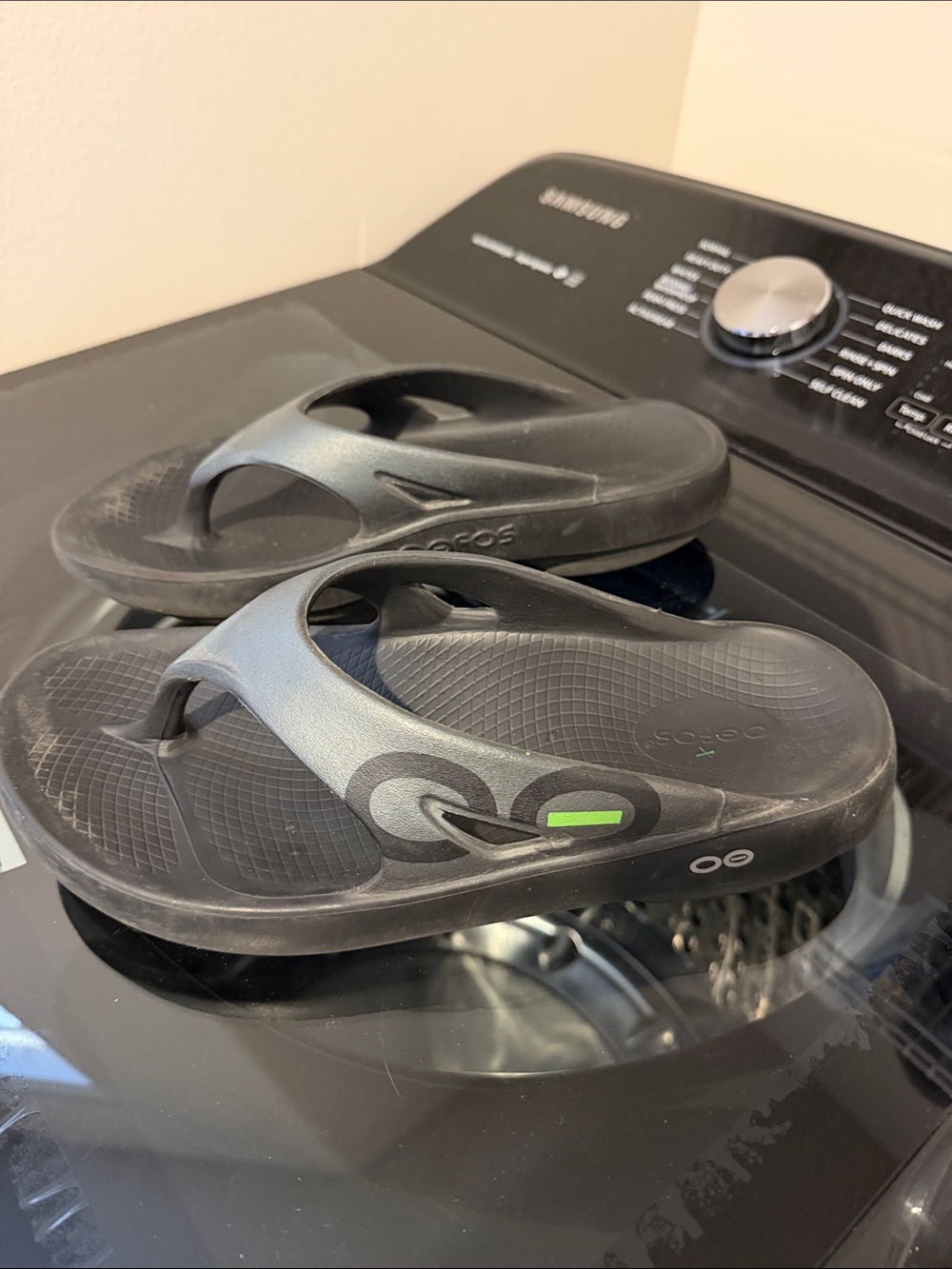 OOFOS Black Recovery Flip Flops with Green Accent